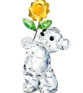 Enough to brighten anyone's day, this cute Kris Bear figurine shines in fully faceted Swarovski crystal. A gleaming yellow sunflower adds to his charm.