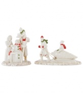 Mistletoe Park villagers revel in the spirit of the holidays, building snowmen and pulling home trees in two beautiful porcelain figurines accented with gold and Christmas-color detail. From Lenox.