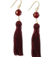 Totally on trend! Tassels are the thing this season, and these crimson-colored tassel and carnelian bead earrings (8-3/4 ct. t.w.) complete the look. Set in 18k gold over sterling silver. Approximate drop: 2-1/4 inches.