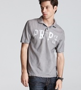 Slim fit polo with faded logo lettering and distressed accents in a slim fit.