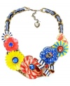 In full bloom. Betsey Johnson's bold statement-making style features a multitude of bright flowers in red, blue, and yellow. Necklace crafted in gold-plated mixed metal with crystal accents, a crystal-encrusted skull, a butterfly charm and a blue and white grosgrain ribbon. Approximate length: 18 inches + 3-inch extender. Approximate drop: 2-1/4 inches.