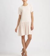 Soft, fluid silk, in a wear-everywhere tee silhouette with a full, gathered skirt.CrewneckShort sleevesDrop waistGathered skirtBack zipSilkDry cleanMade in Italy of imported fabric