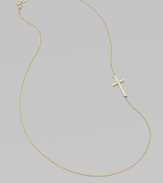 A wispy chain of 14k yellow gold features a cross pendant, punctuated by a single sparkling diamond, set askew for a modern edge.Diamond, .02 tcw 14k yellow gold Length, about 16 Pendant length, about ¾ Spring ring clasp Made in USA