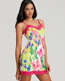 Send your dreams to somewhere tropical in this bright floral print chemise with pretty lace trim.