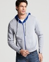 Crafted in soft pima cotton, this breathable zip hoodie reverses to the trim's color.