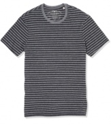 Sweet stripes. Get your casual look on the straight and narrow with this striped tee from Guess.