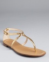 Glimmering gold-tone leather makes a glamourous statement on Boutique 9's Paulyne sandals.