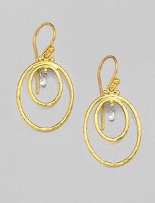 From the Geo Collection. Charming, white diamond briolettes dangle within two oval rings of hand-hammered, 24k yellow gold. Diamonds, 0.23 tcw 24k yellow gold Drop, about 1¼ Width, about ¾ Ear wire Imported 