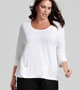 This Eileen Fisher top is rendered in lightweight linen with ribbed knit trim and a pocket at the hem for easy access to small belongings.