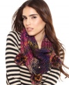 Let your free-spirited style shine through with this colorful infinity scarf from Betsey Johnson that's outfitted with playful pom pom accents for a totally whimsical feel.