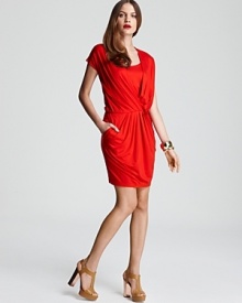 Fluid draping lends fiery dimension to this standout DKNY dress. Garnish with gold accents and set your cocktail style afire.