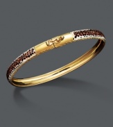 Put a fierce, new spin on your style. This wild bangle features a leopard print enamel surface with diamond-cut edging. Crafted in 14k gold over sterling silver and sterling silver. Approximate diameter: 2-1/2 inches.