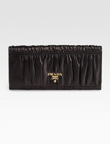 Dramatic pleating in supple lambskin opens up to ten credit card slots and four billfold compartments.Goldtone logo detail Snap closure Inside zipper Lambskin lining 7½W X 3½H X ½D Made in Italy