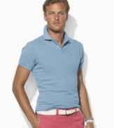 A trim-fitting short-sleeved polo shirt is rendered in breathable cotton mesh for superior comfort and style.