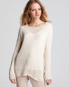 An lightweight Vince linen sweater features a diagonal cut-out through the bodice for a unique take on the sheer trend. Team the airy look with relaxed khakis for the perfect lightweight ensemble.