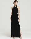 Brimming with elegance, this T Tahari maxi dress showcases a knotted halter neckline atop a dramatic silhouette. Two side slits amp up the wow factor.