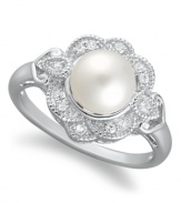 A fine display of poise and sophistication, this elegant cultured freshwater pearl ring (7 mm) presents a touch of vintage flair with the addition of diamond-studded (1/10 ct. t.w.) petals. Crafted in sterling silver. Size 7.