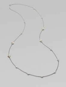 From the Windsor Collection. A long and lovely chain of textured oval links is sprinkled with shapely little medallions sparked white sapphires. White sapphires Sterling silver and 18k yellow gold Length, about 34 Lobster clasp Imported