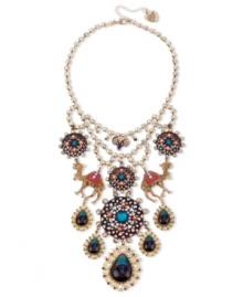 Get over the fashion hump. Betsey Johnson's fun bib necklace combines gold tone setting with crystal cup chain, glitter camel charms with multi-colored details and crystal accents, round medallions with flower and crystal accents, purple and blue teardrop with crystal accents. Set in antiqued gold tone mixed metal. Approximate length: 16 inches + 3-inch extender. Approximate drop: 6-1/2 inches.