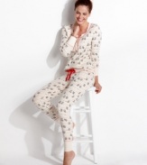 Lounge around in style. Kensie's Quite The Character pajamas feature a front placket up top and rib cuffs on the top and bottom.