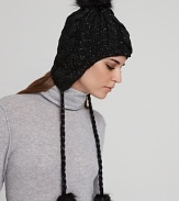 Keep cozy and look cool on the slopes or city streets in Eugenia Kim's cable-knit, pom pom accented cap.