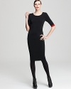 Ruched at the sides for an elegant effect, this Donna Karan New York dress is designed to skim the body and streamline the silhouette. Mirror the contrast lining with bold scarlet accents.