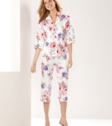 Snuggle up in a pretty springtime print. Morgan Taylor's ruffle top and pants pajama set features quarter-length sleeves and capri pants.