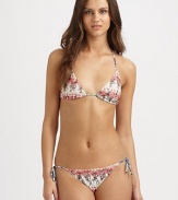 A pretty muted print meets a classic swim design with self-tie details for an impeccable fit.Halter strap ties at neckTriangle cupsStretch bottomSide tiesRayonHand washMade in Italy