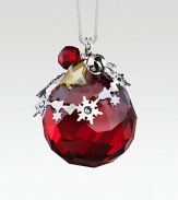 A cheery, faceted crystal sphere in holiday red, sweetly adorned with silvertone shapes and a tiny jingle bell.CrystalSilvertoneAbout 1.5H X 1.25WMade in Austria