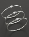 From the Batu Bamboo collection, a set of three slim bamboo bangles with white topaz accents. Designed by John Hardy.