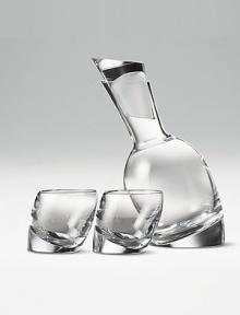 This modern bar set has all the angles: a full lead crystal decanter with matching stopper and two gently tilted double old-fashioned glasses. Handmade Comes in Nambé blue gift box 11 decanter 10 oz. glasses Hand wash gently Imported