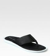 Embossed logo thong upper comfortably completes this flip flop sandal with contrast sole.Rubber soleImported