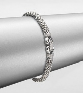 From the Derby Collection. A sterling silver buckled design accented with iconic caviar texture and dazzling diamonds. Sterling silverDiamonds, .09 tcwLength, about 7.5Box and tongue closureImported 