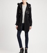 Versatile parka with a fox fur collar and inner removable rabbit fur vest for added warmth.