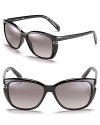 Stylish rounded cat eye sunglasses with subtle F accents along arms and temples.