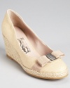 These Salvatore Ferragamo espadrille wedges exude timeless chic in three colors of canvas.