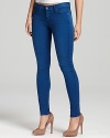 Subtle fading creates a cool sun-bleached effect on these vibrantly hued 7 For All Mankind skinny jeans.