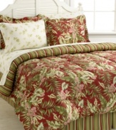 Reminiscent of an island paradise, this Exotic Floral bedding ensemble boasts a bold print of tropical leaves and flowers in a rich green and red palette. Comforter reverses to a chic stripe design that matches with the accompanying bedskirt. Comes complete with coordinating sheet set for a completely restful retreat in your room.