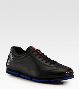 Sleek and sporty lace-up design rendered in Italian calfkskin leather.Leather upperPadded insoleRubber soleImported