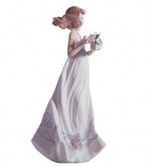 Enchanted by the quiet beauty of butterflies, this pretty young woman has a sense of sweet innocence in handcrafted porcelain. A classic figurine for the Lladro collector.