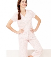 A pretty print gives a cheerful feel to this everyday essential pajama set by Charter Club. Scallop trim adds a delicate, dainty appeal.