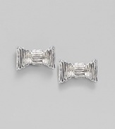 Fluted bows create an ultra feminine look in these silvery studs.Silvertone Width, about ¾ Post back Imported