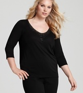 A basic Eileen Fisher silk top is lent subtle glamour with a scattering of tonal beads and sequins at the neckline.