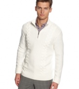 Traditional detailing in a fine knit creation. Calvin Klein's classic cable sweater redefines debonair style.