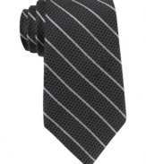 Skinny stripes make a subtle statement that still gets noticed with this DKNY silk tie.