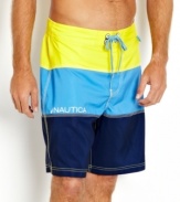 Building block basic. Jump into these colorblocked swim trunks from Nautica then hit the surf in style.