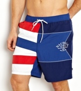 Fly the flag. These color-block board shorts from Nautica are beach-worthy trunks to take you into the surf in comfort.