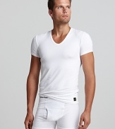 A comfy, slim fit v-neck shirt rendered with Calvin Klein's signature minimalist oeuvre.