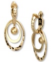 Golden glam. These Jones New York hoop earrings double down on fashion with multi-hoops and a ball pendant. Clip-on backing for non-pierced ears. Crafted in worn gold tone mixed metal. Approximate drop: 1 inch.