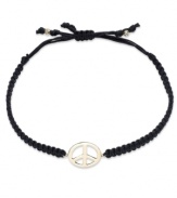 Give peace a chance! This trendy wrap bracelet features a 14k gold peace sign charm strung from a black nylon rope cord. Approximate diameter: 2-1/4 inches (extends to 3-1/2 inches).